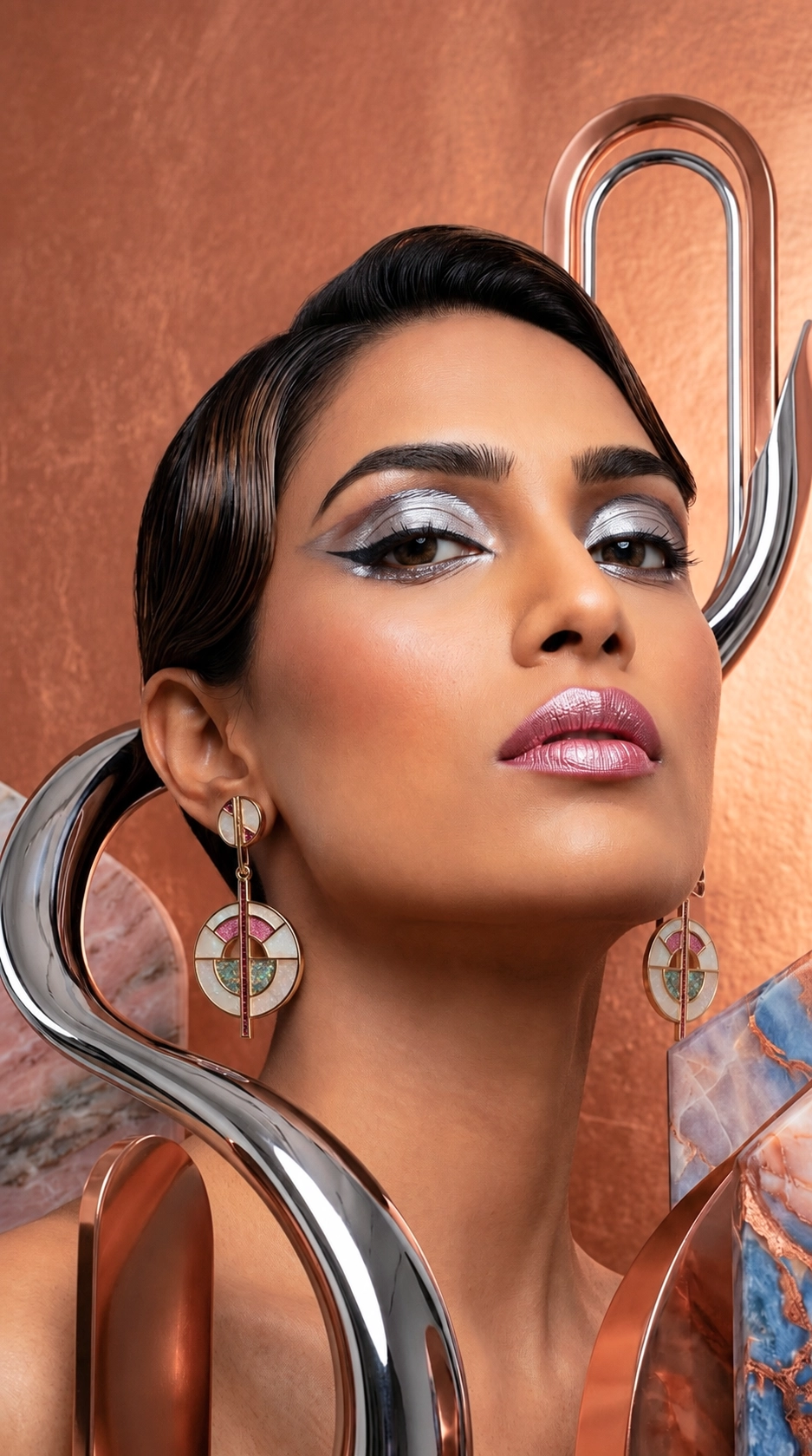 The same earrings worn by a model showing scale and how the piece sits on the ear